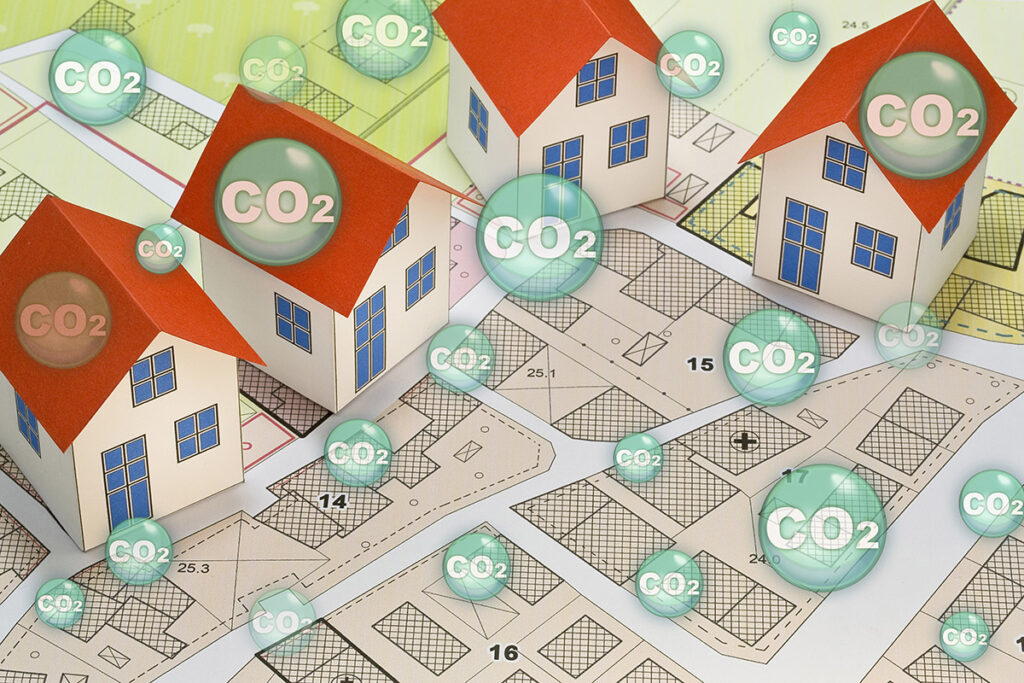Concept image showing housing plans with CO2 bubbles 