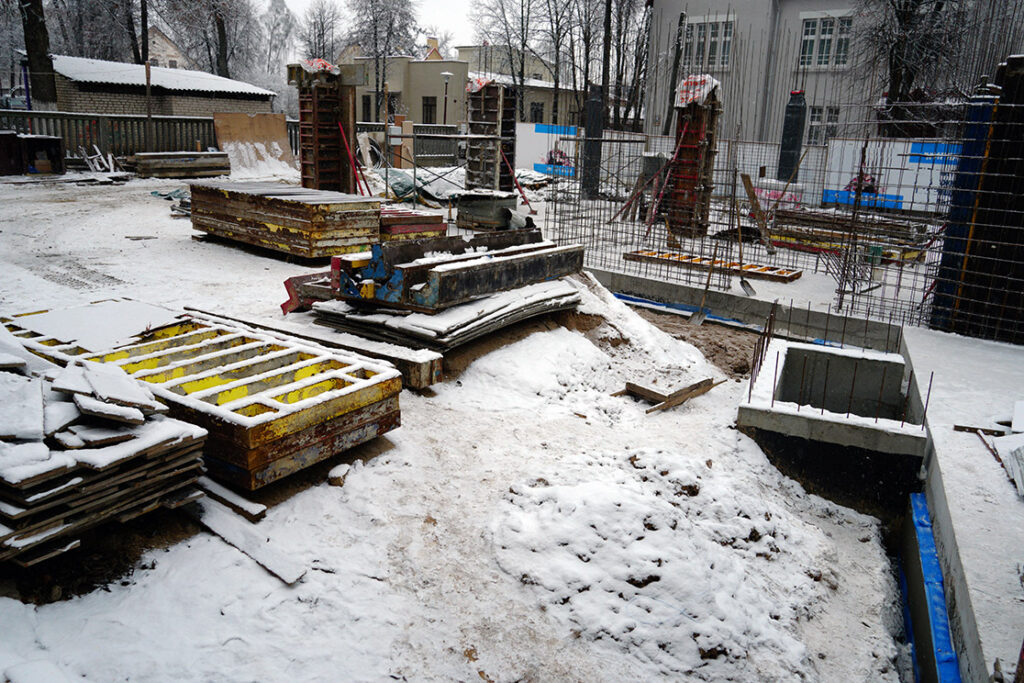 A snowy building site showing how weather can delay work on site