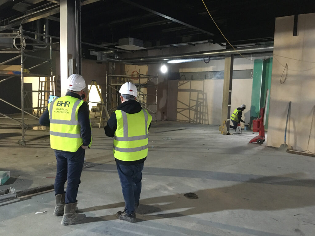 Client consultation on site at the start of a franchise fitout