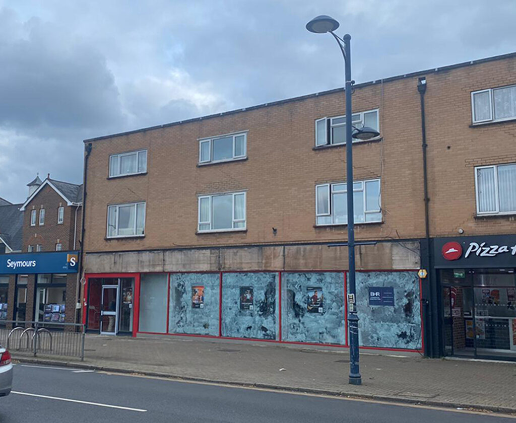 Exterior of Addlestone Snap Fitness 24/7 unit with flats above