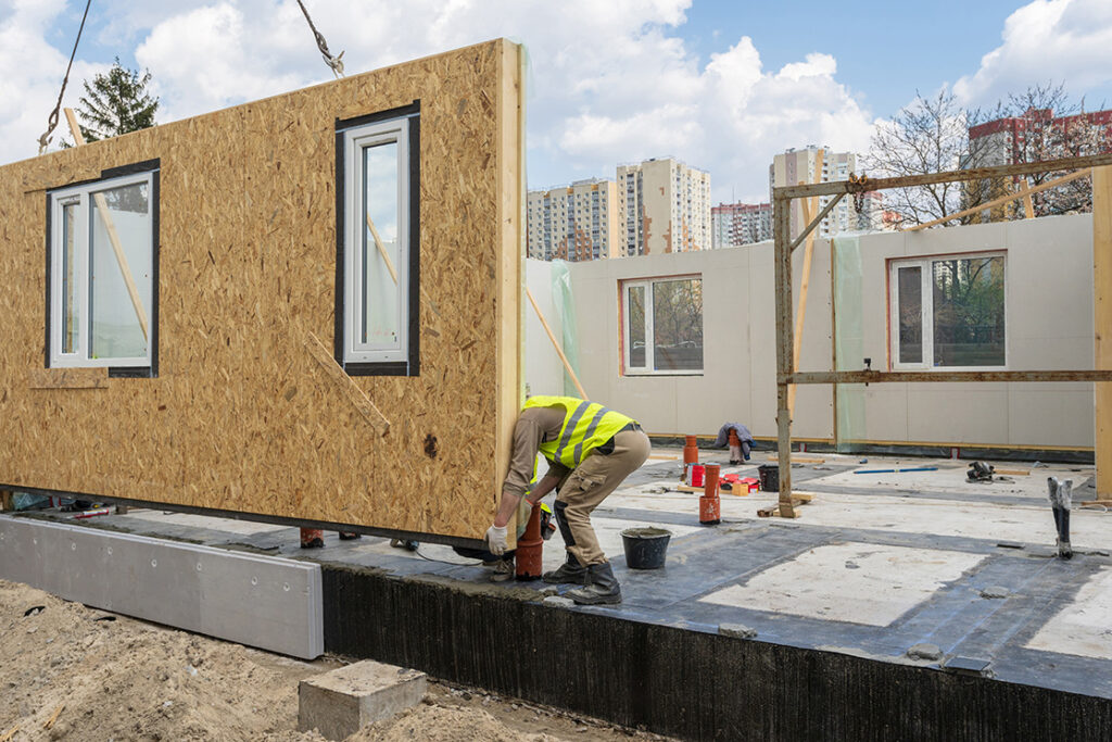 Prefabricated sections of a business unit being assembled on site 